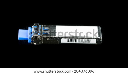 Optical gigabit SFP module for network switch isolated on over black background