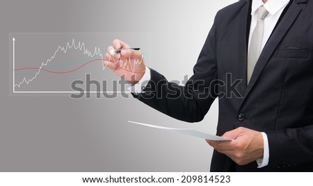 Businessman standing posture hand hold a pen on gray background