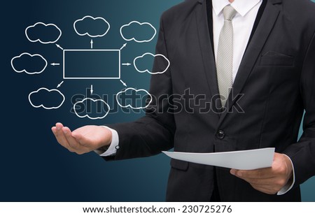 Businessman standing posture hand holding strategy flowchart isolated on dark background