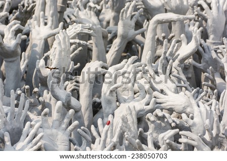 Devil\'s Hands from Hell, one of many beautiful decorations in Rong Khun Temple in Chiang Rai of Thailand