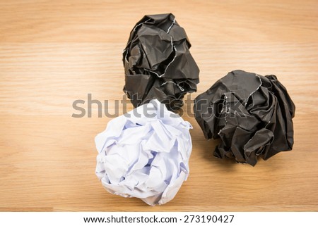 Black paper ball corrugate on wooden background