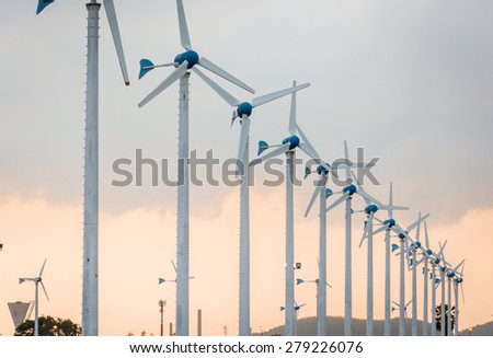 Wind power station against and light sunset, Power generation wind turbines