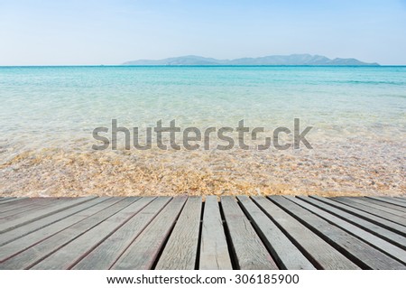 Beach Scene With Wooden Floor background can put or montage your products