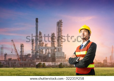 Businessmen engineering standing handsome smile in front of oil refinery industry