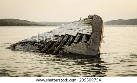 Lake Superior Shipwreck. Ghostly wooden shipwreck washed up on the remote shores of Lake Superior. Pictured Rocks National Lakeshore. Munising, Michigan.