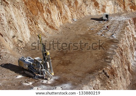 Drilling holes for demolition in a rock quarry near Split, town in Croatia