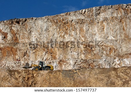 Bulldozer working in a rock quarry near Split in Croatia