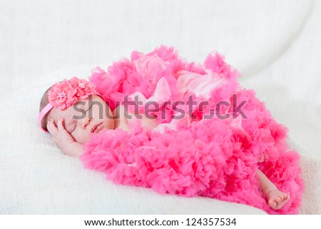 sleeping small princess in pink laces (the newborn girl)