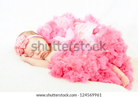 sleeping small princess in pink laces (the newborn girl)