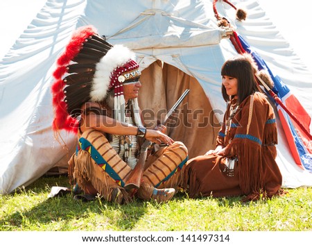 Group of North American Indians about a wigwam