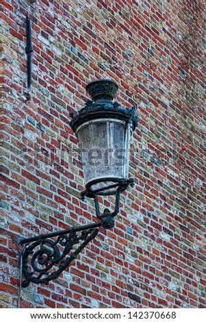 Decorative lamp on a brick wall