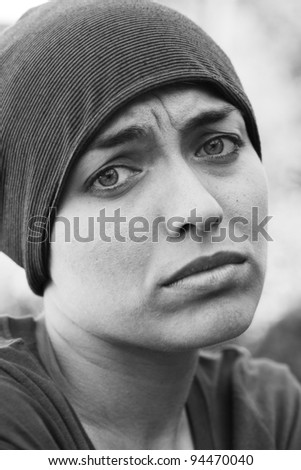 Monochrome portrait of very sad girl
