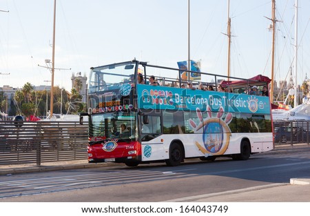 BARCELONA, SPAIN - SEPTEMBER 30: Tourist bus in Barcelona, Spain , September 30, 2013. Barcelona City Tour is a new official touristic bus service that shows the city with an audio guide.