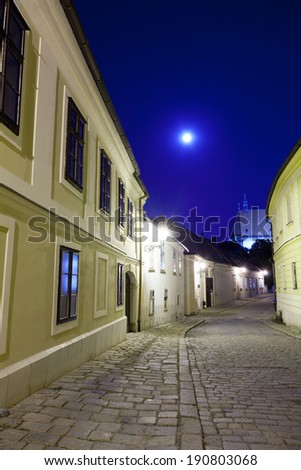 deserted street of the old European city in a full moon