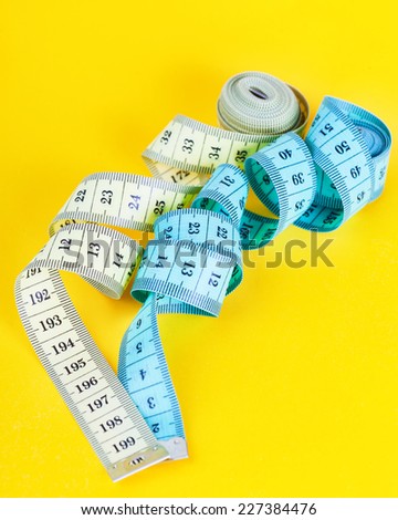 White and blue tape-line to lie on a yellow background