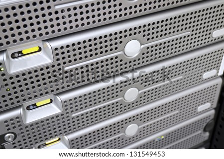 Some servers and a disk cabinet / SAN mounted in a rack. Shot in a data center.