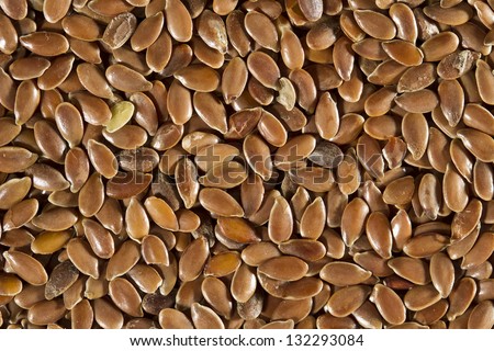 Dried brown flax seeds. Can be used as background. Flax is also known as common flax or linseed (Linum usitatissimum).