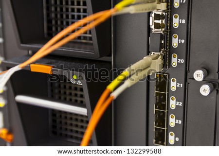 A fiber optical card / switch on a blade server in a rack. Shot in a datacenter.