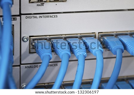 Close up of a cat 5 / 5e / 6 patch cable into a PBX (Private Branch Exchange) switch station for telephone systems.