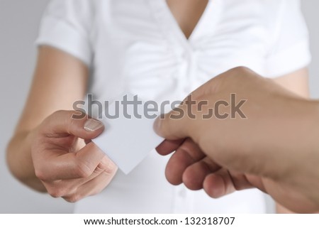 Woman give away business card. Place your business card or corpate logo on the card.