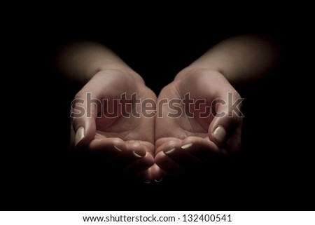 Woman hands begging with outstretched hands. Hands forming a cup.
