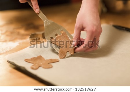 Woman baking ginger bread for Christmas. Natural Colors. Real life