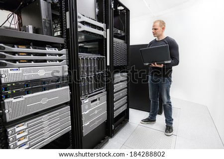 It technician monitors data center