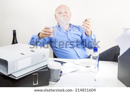 Drunk businessman smokes and drink at office