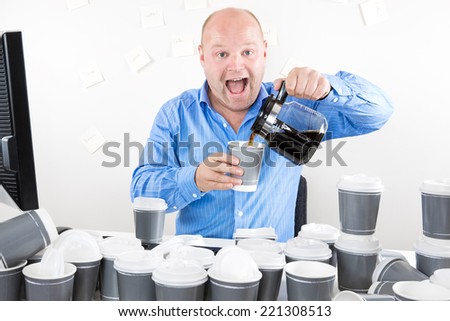 Happy businessman drinks way too much coffee
