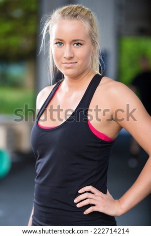 Blonde woman in workout outfit at the fitness gym