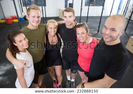 Happy fitness workout team at the gym