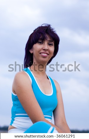 healthy seated woman half body  smiling outside