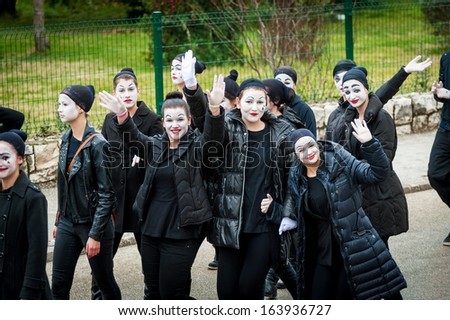 METKOVIC, CROATIA - FEBRUARY 10: Young boys and girls masked as mimes participate in the masquerade parade in Metkovic, Croatia on February 10,2013.
