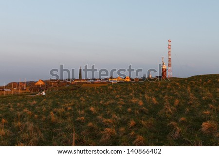 Evening mood on Helgoland with lighthouse and church