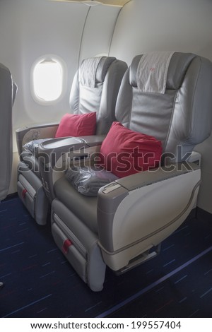 Aircraft cabin and passenger with hat