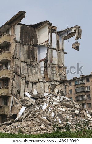 tearing down concrete buildings