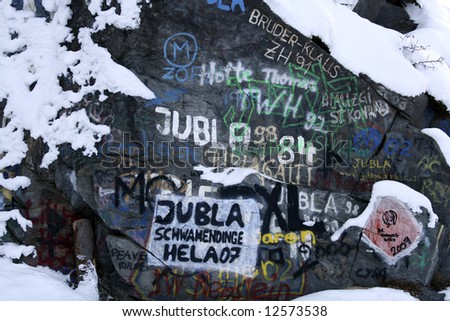 Graffiti sprayed on a big rock