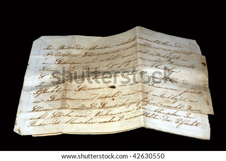 Old paper with cursive scripture isolated on black