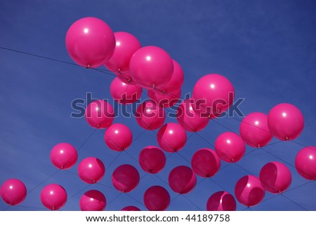 pink balloons on a blue sky