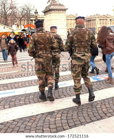 Paris, France - December, 2013: French Soldiers Patrol The Streets During The Christmas Period In Champs-Elysees, Paris