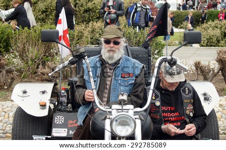 HASTINGS, UK - MAY 04, 2015: Bikers with their three wheel bike in the Biker\'s Festival which takes place every year in seaside town called Hastings, UK