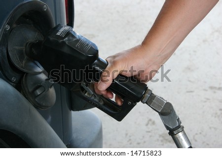 man pumping gas