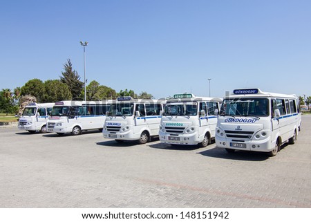 SIDE - JULY 21: Turkish shared buses, Dolmushes in main bus stop on July 21 in Side. This small buses are the most common way to travel on short distances in Turkey.