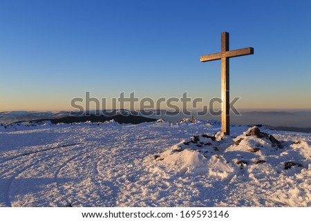 A Cross On The Top Of Pilsko Mountain With Tatra Mountains In The Background, Poland
