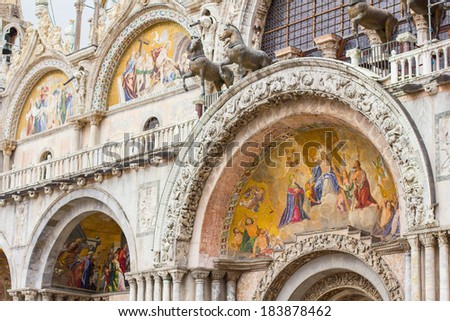 A closeup of  the ornate outer architecture and paintings of Saint Mark\'s Basilica in Venice, Italy