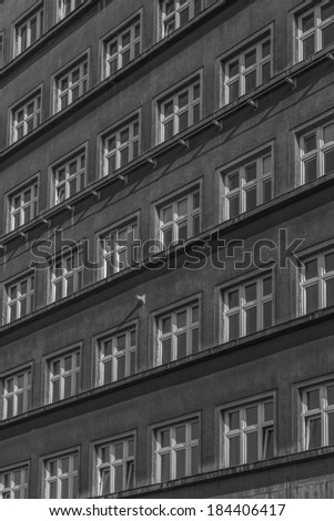 A row of windows in black and white colors