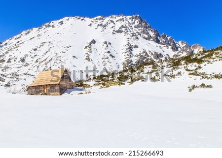 Wooden house in mountains in winter scenery, Tatras Mountains, Poland