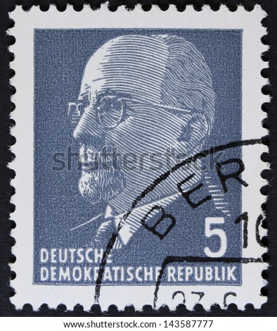 GERMAN DEMOCRATIC REPUBLIC - CIRCA 1961: A stamp printed in Germany shows the leader of East Germany from 1950 to 1971 Walter Ulbricht, circa 1961. Vintage stamp isolated on black