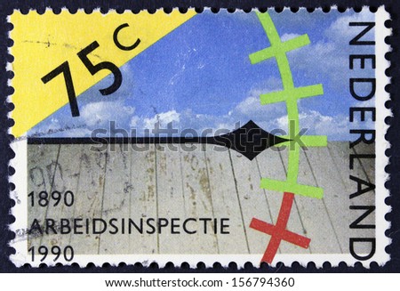 NETHERLANDS - CIRCA 1989: a stamp printed in the Netherlands shows Clock, Sky and Wooden Floor, Assessing Work Conditions, Centenary of Labor Inspectorate, circa 1989