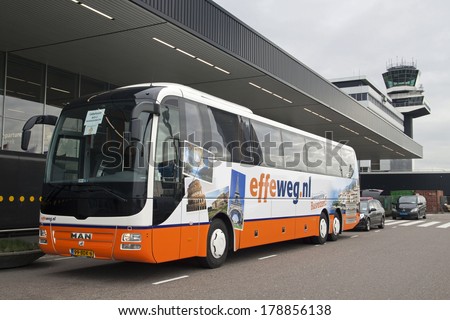 AMSTERDAM, HOLLAND - FEBRUARY 23, 2014: Parked tourist bus for departure at Schiphol Airport